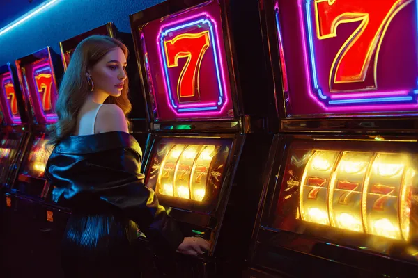 SPORTYBEF Jackpot Slots — Spin for massive rewards A dramatic shot of winning sevens landing on a slot reel surrounded by shining gold coins, symbolizing big wins.
