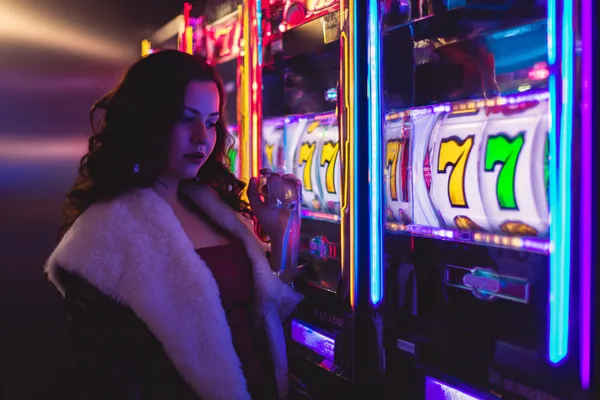 SPORTYBEF Mobile Casino — Play anytime, anywhere A player using their smartphone during a festive local event, representing SPORTYBEF’s fully mobile-friendly casino.